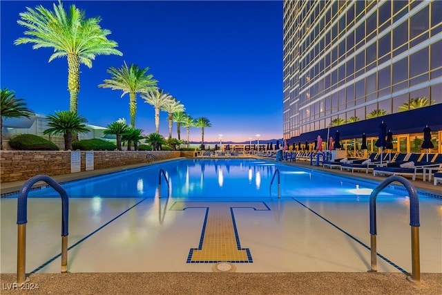 view of pool at night