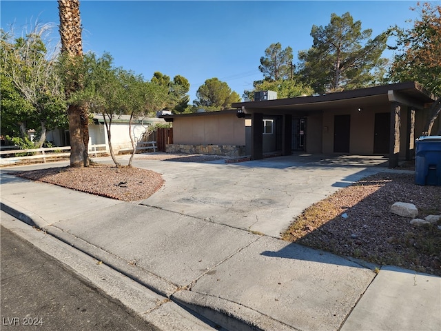 view of front of property with a carport