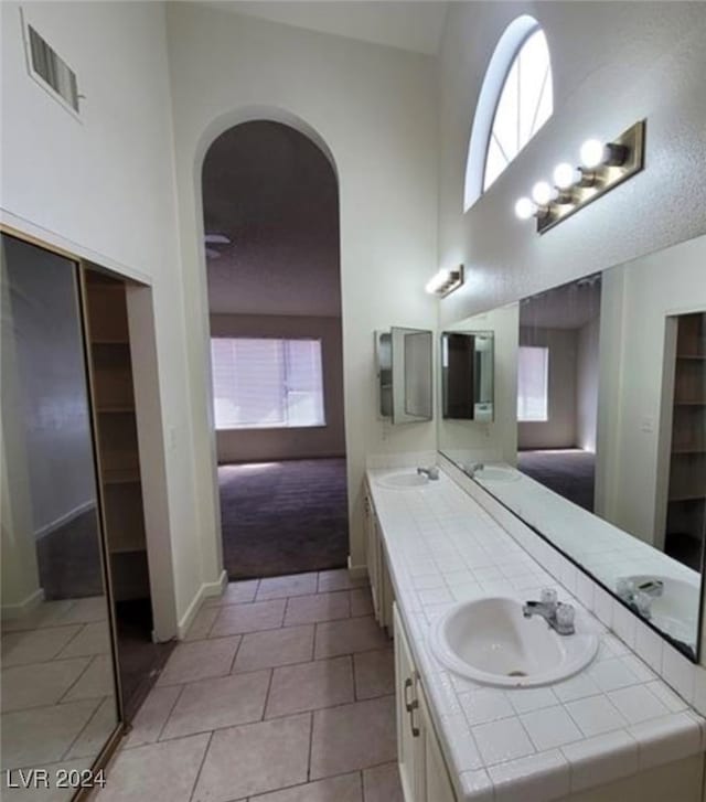 bathroom featuring tile patterned flooring and vanity