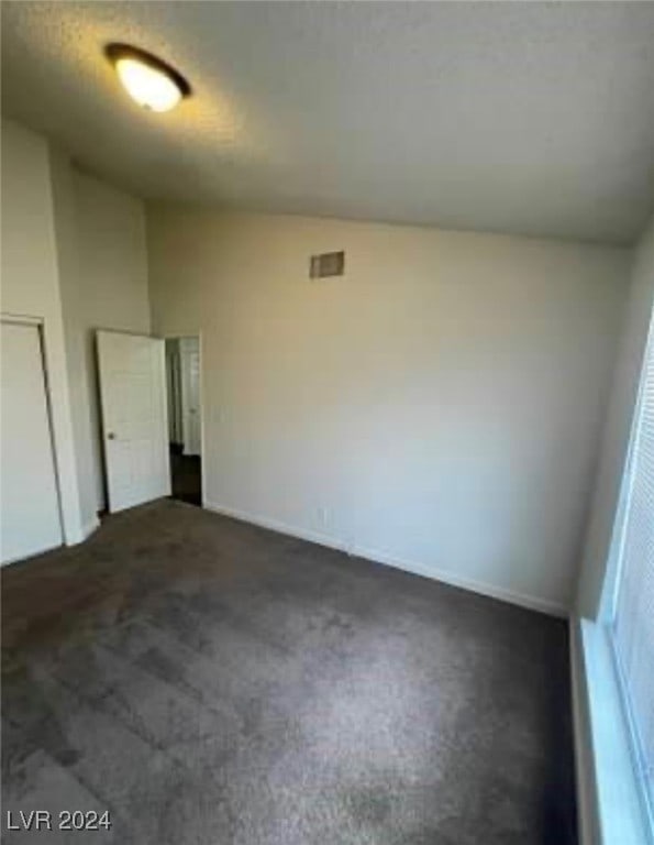 unfurnished room with carpet flooring