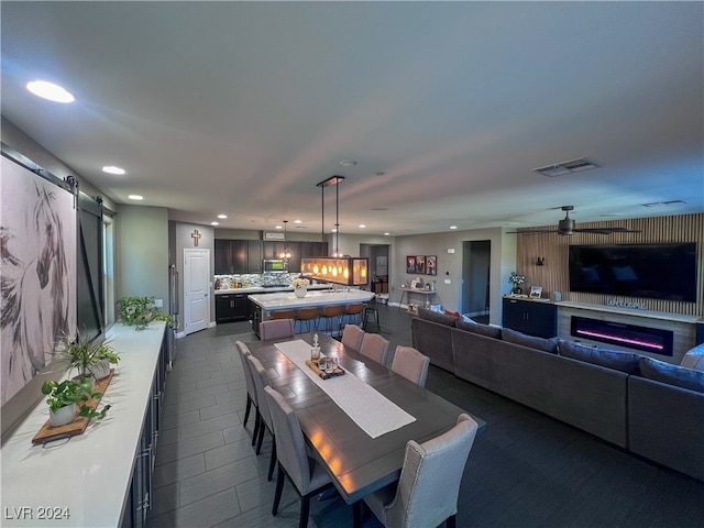 dining room with a barn door