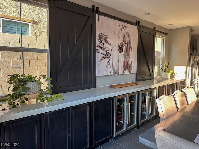 interior space featuring a barn door and indoor bar