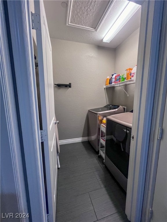 washroom with independent washer and dryer