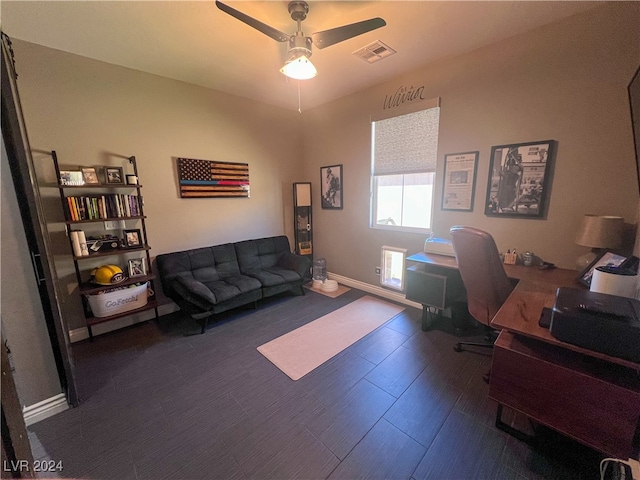 office with ceiling fan and dark hardwood / wood-style flooring