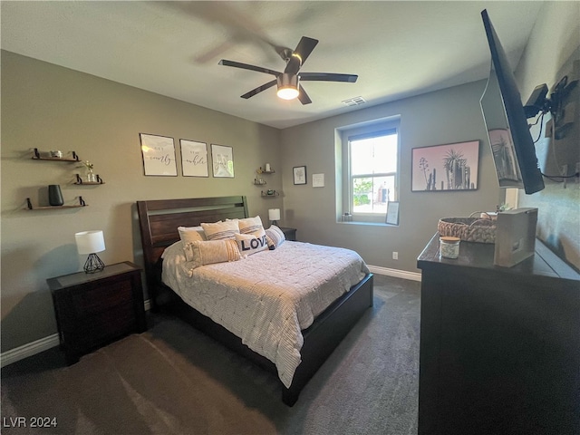 bedroom featuring dark colored carpet and ceiling fan