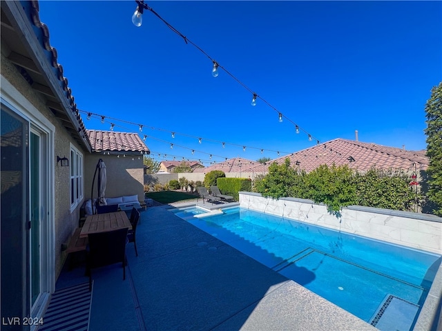 view of pool with a patio