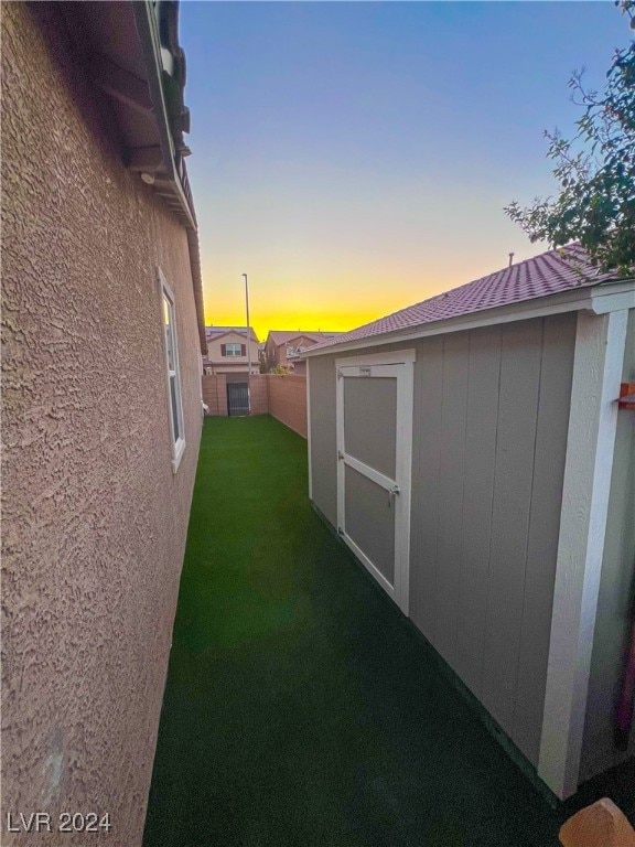 exterior space featuring a storage shed