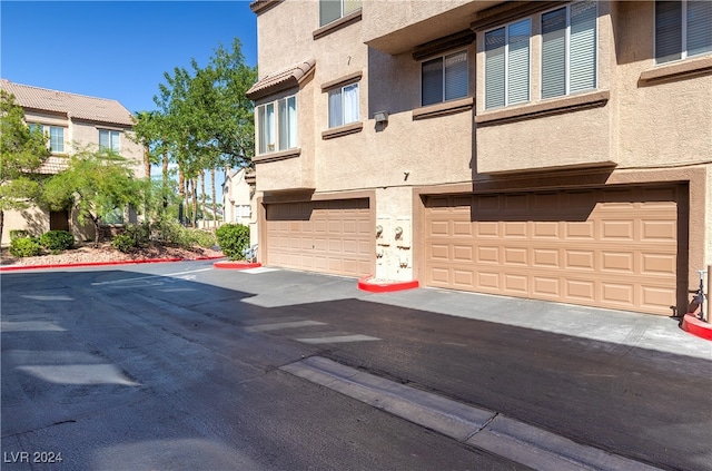 view of building exterior with a garage