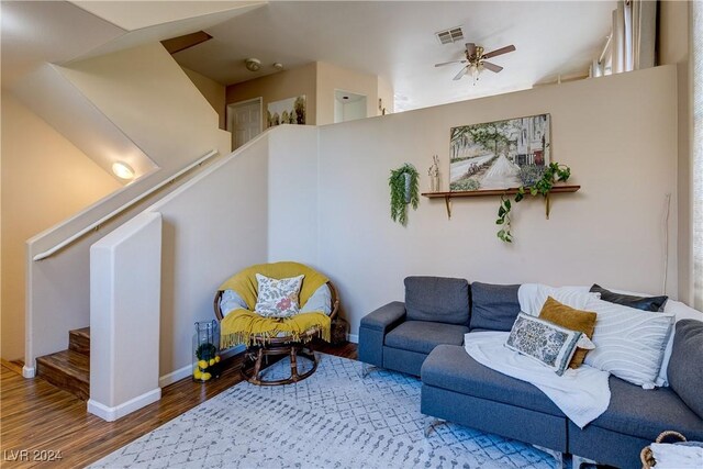 living room with hardwood / wood-style floors and ceiling fan