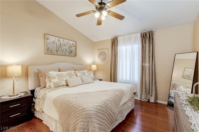 bedroom featuring ceiling fan, vaulted ceiling, and dark hardwood / wood-style flooring