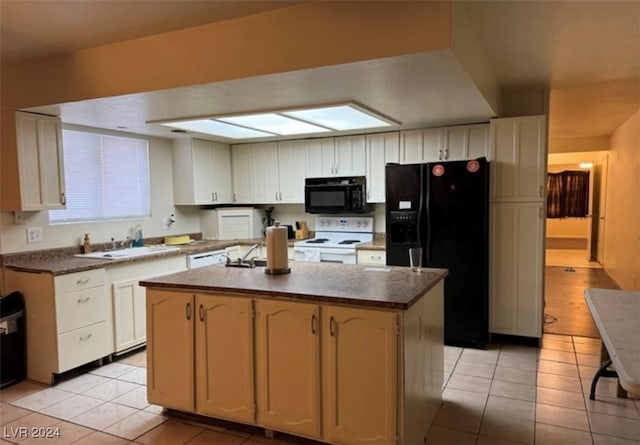 kitchen with black appliances, light tile patterned flooring, a center island, and sink