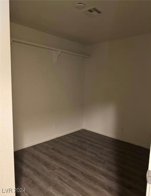 unfurnished room with hardwood / wood-style floors