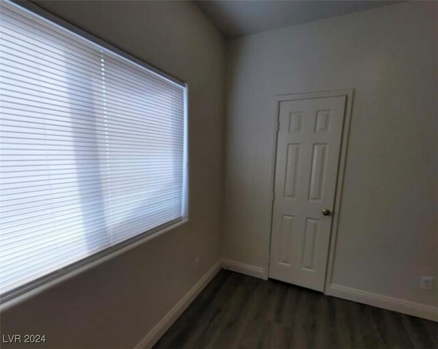 unfurnished room featuring dark hardwood / wood-style floors