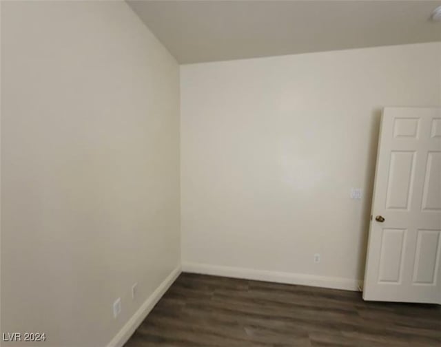 spare room featuring dark hardwood / wood-style floors