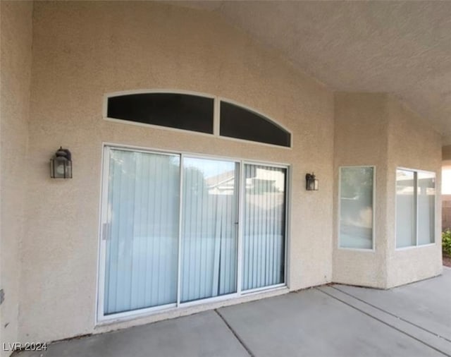 entrance to property with a patio area