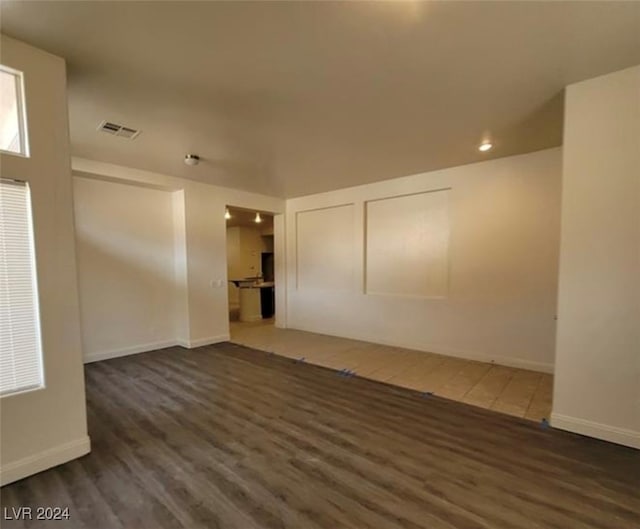 empty room featuring dark wood-type flooring