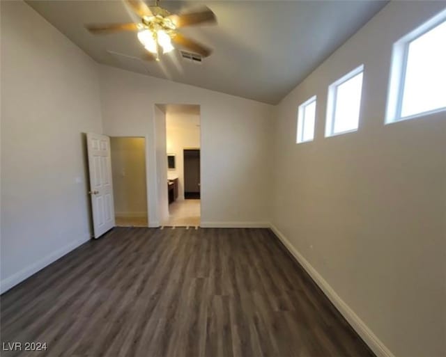 unfurnished bedroom with dark wood-type flooring, lofted ceiling, and ceiling fan