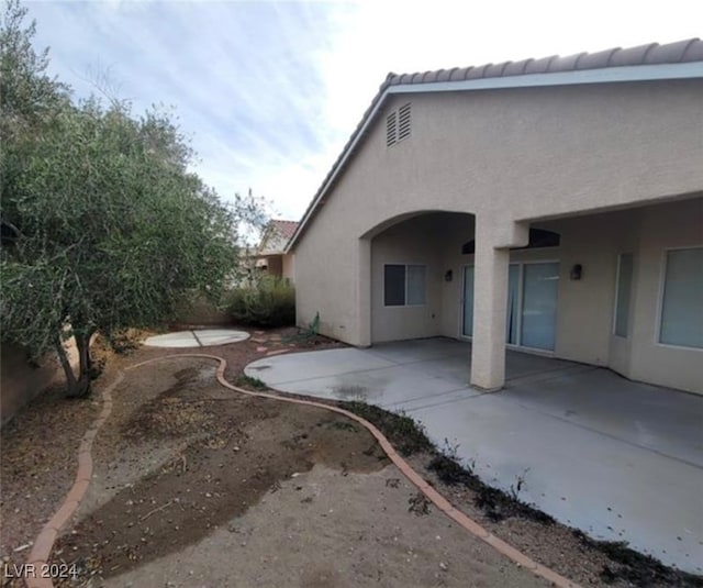 rear view of property with a patio