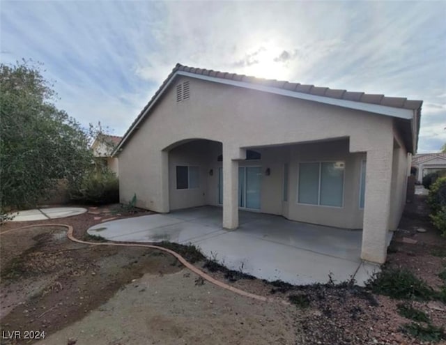 rear view of house with a patio area