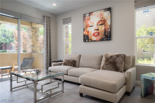 tiled living room with a healthy amount of sunlight