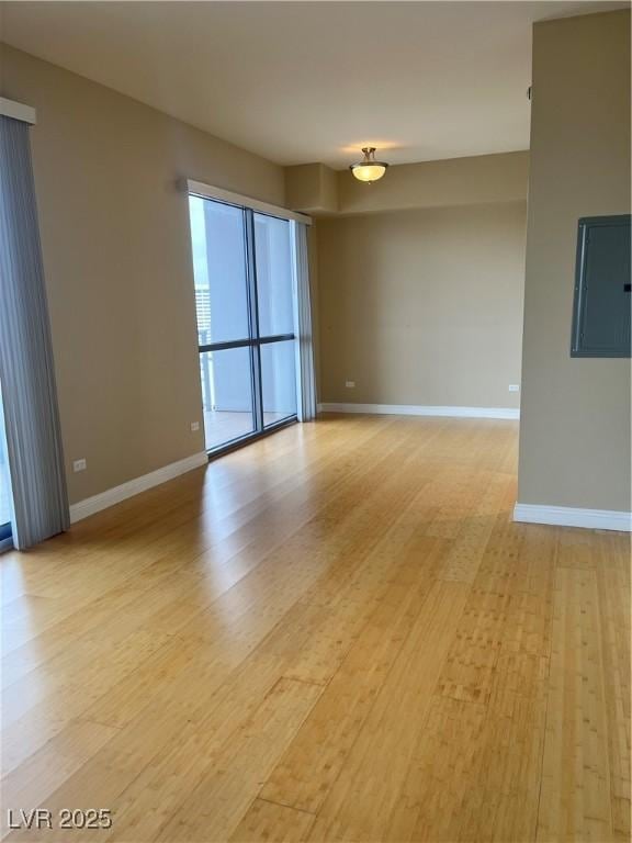 spare room featuring light wood-type flooring