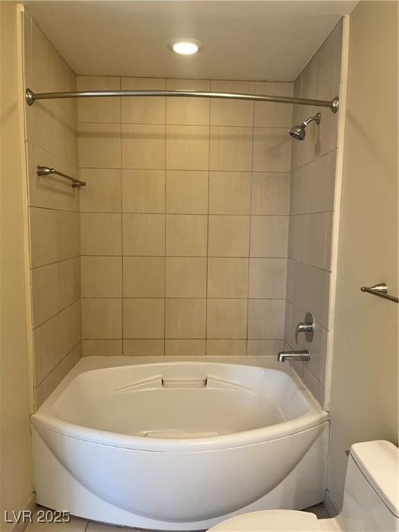 bathroom featuring tile patterned flooring and toilet