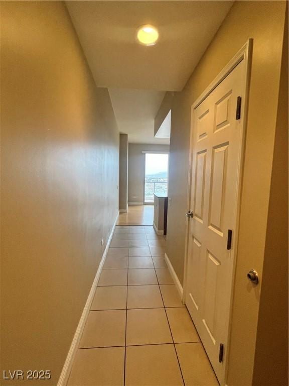 corridor with light tile patterned floors