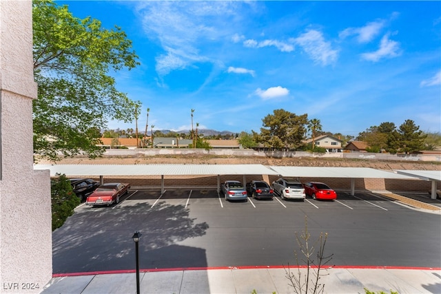 view of parking featuring a carport