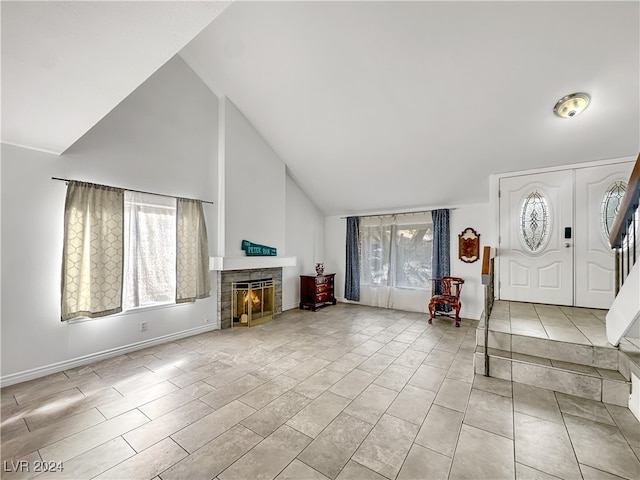 entryway featuring high vaulted ceiling