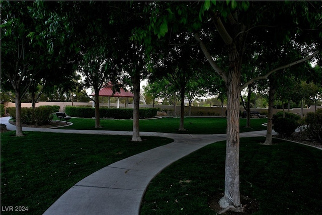 surrounding community with a lawn and a gazebo