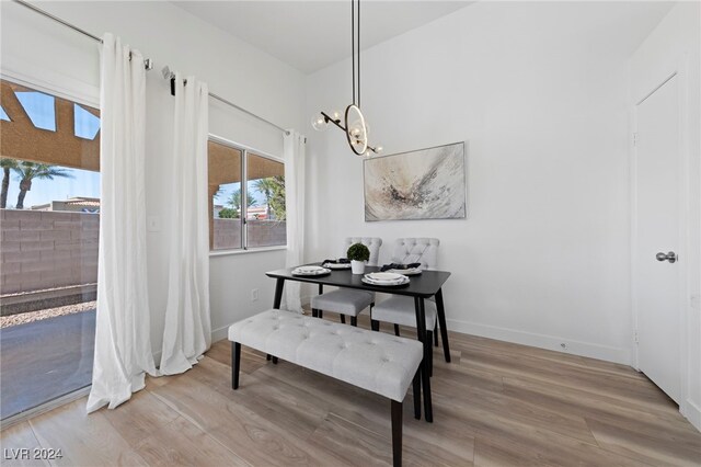 dining room featuring a notable chandelier and light hardwood / wood-style floors