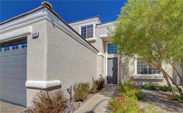 property entrance with a garage