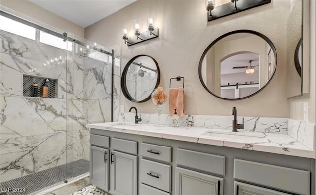 bathroom featuring vanity and a shower with door