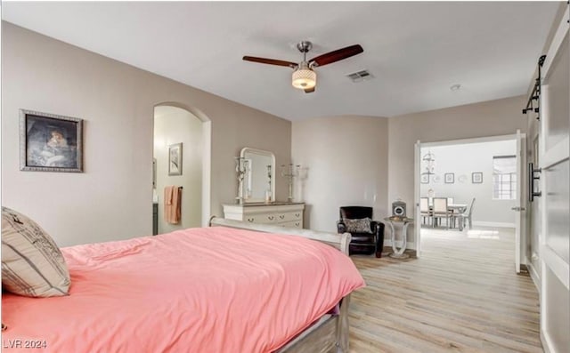 bedroom with ceiling fan and light hardwood / wood-style floors