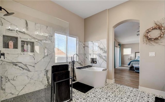 bathroom with wood-type flooring and separate shower and tub