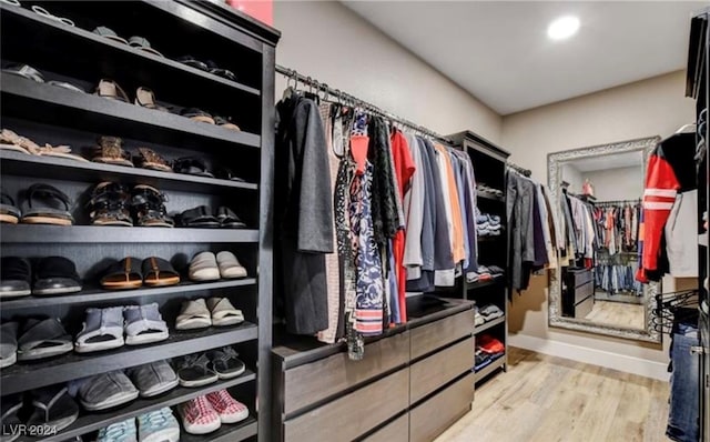 walk in closet featuring light hardwood / wood-style floors