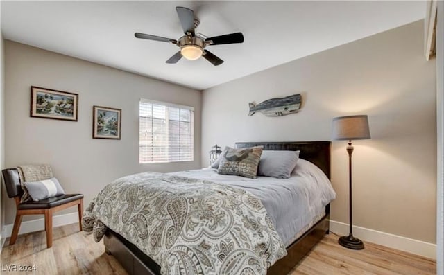 bedroom featuring ceiling fan and light hardwood / wood-style flooring