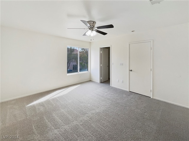 interior space with ceiling fan