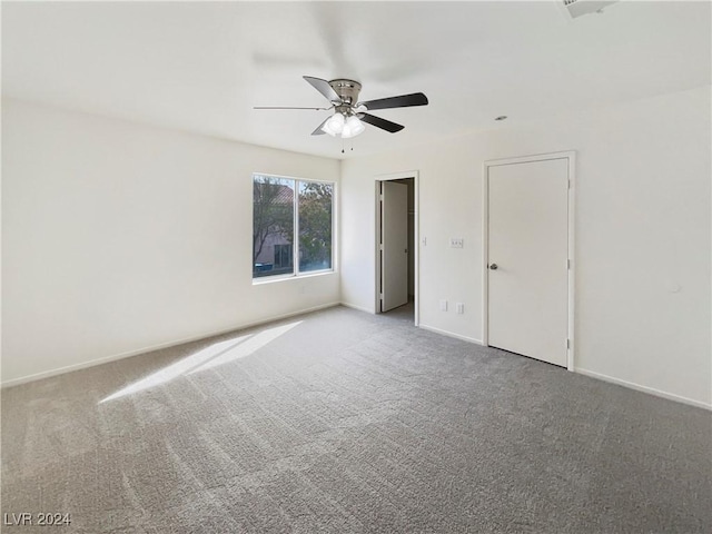 unfurnished bedroom with ceiling fan, baseboards, and carpet floors