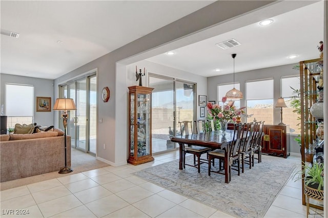 dining room featuring light tile patterned floors, visible vents, recessed lighting, and baseboards