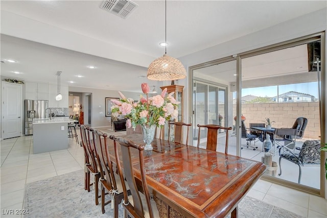 dining space with light tile patterned floors, recessed lighting, and visible vents