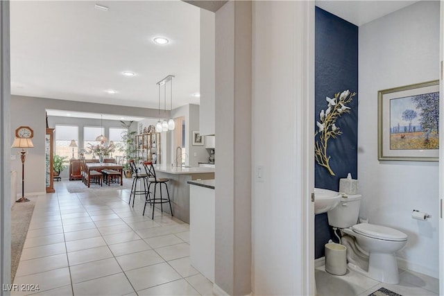 bathroom featuring tile patterned floors, toilet, recessed lighting, and baseboards