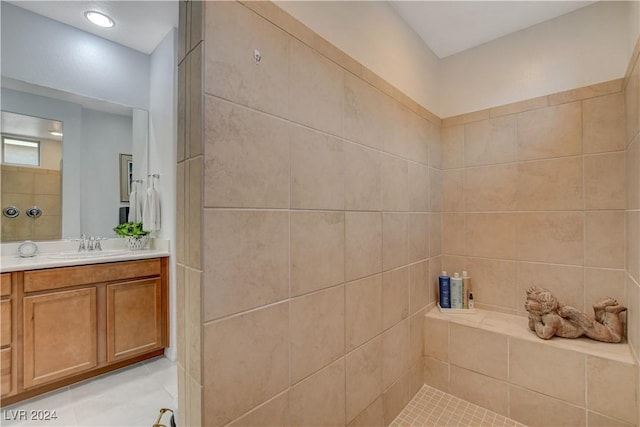 bathroom featuring vanity and a tile shower