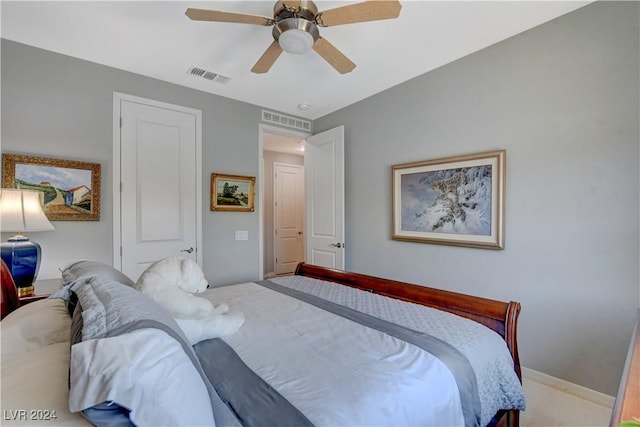 bedroom featuring a ceiling fan, carpet, visible vents, and baseboards