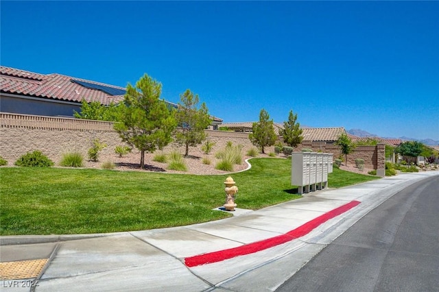 exterior space featuring mail area and fence