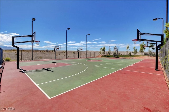 view of sport court with community basketball court and fence