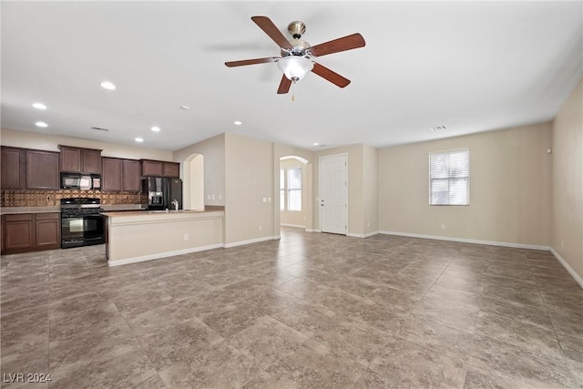 unfurnished living room with ceiling fan and light tile patterned flooring