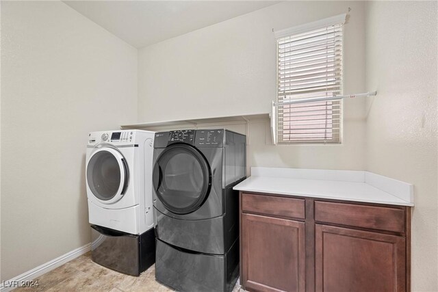 laundry room featuring washer and clothes dryer