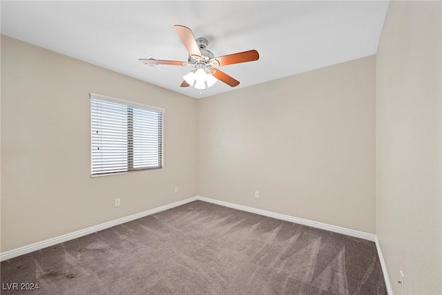 empty room with ceiling fan and carpet floors