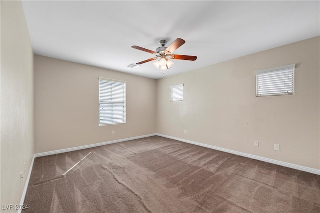 empty room with carpet and ceiling fan